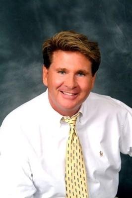 A man in a white shirt and tie.